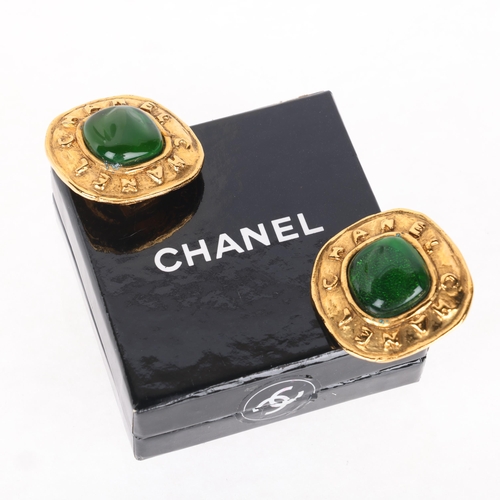 1333 - CHANEL - a pair of Vintage gilt-metal green Gripoix glass clip-on earrings, signed and numbered 26, ... 