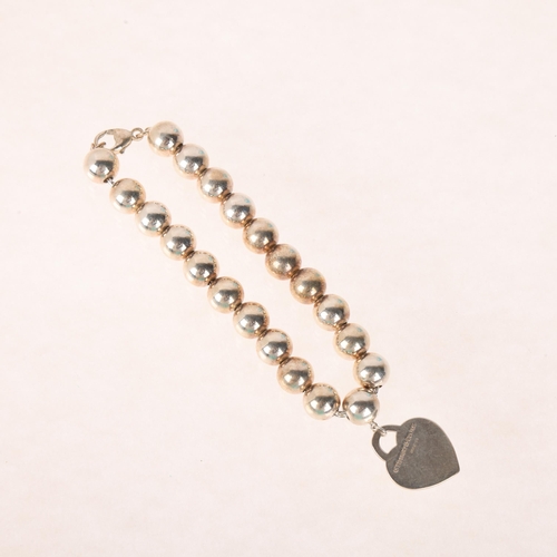 1339 - TIFFANY & CO - a sterling silver 'Please Return To Tiffany & Co' heart toggle bead bracelet, 18cm, 1... 