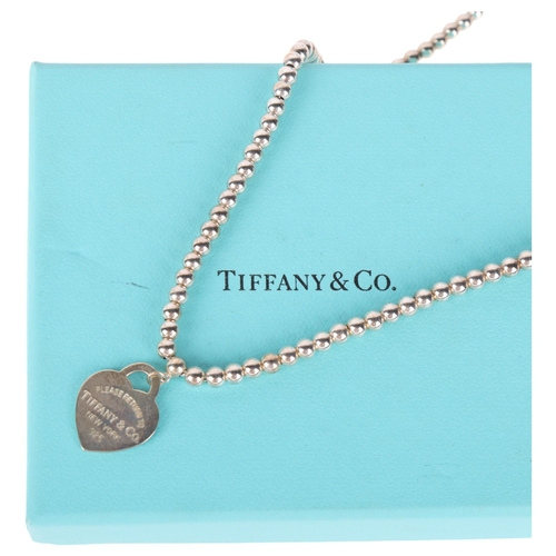 1340 - TIFFANY & CO - a sterling silver 'Please Return To Tiffany & Co' heart toggle bead necklace, 39cm, 1... 