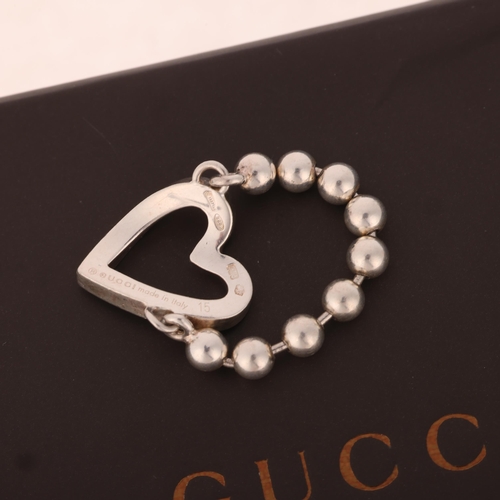 1341 - GUCCI - a sterling silver beaded chain heart ring, setting height 15.9mm, size O, 4.4g, boxed