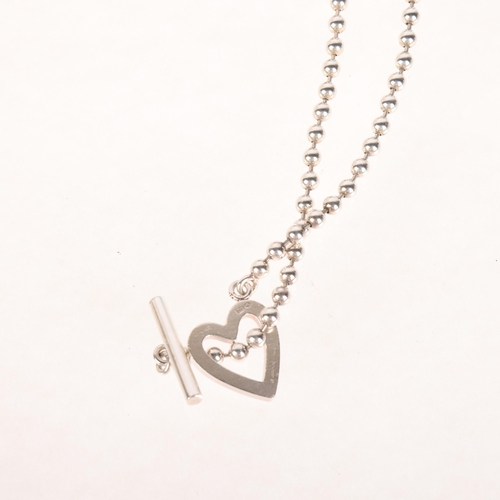 1342 - GUCCI - a sterling silver heart toggle bead necklace, 36cm, 22.2g, boxed