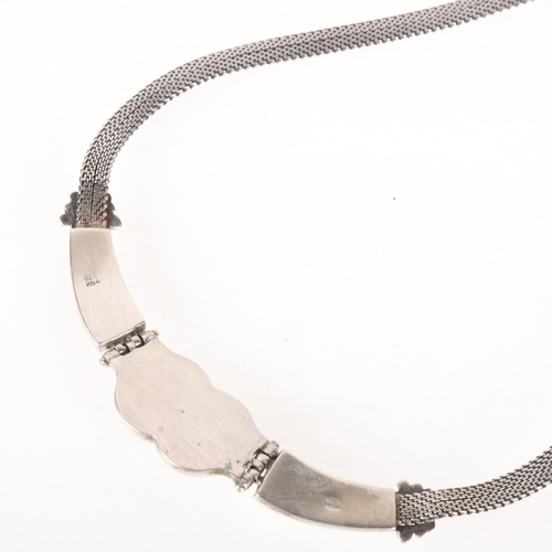 1364 - A Mexican sterling silver garnet collar necklace, relief embossed decoration, maker H64, 44cm, 55.7g