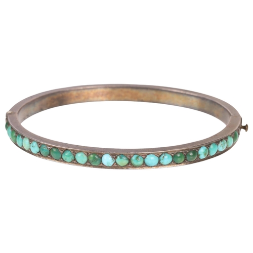 1369 - A Victorian silver turquoise hinged bangle, band width 4.6mm, internal circumference 15cm, 17.4g