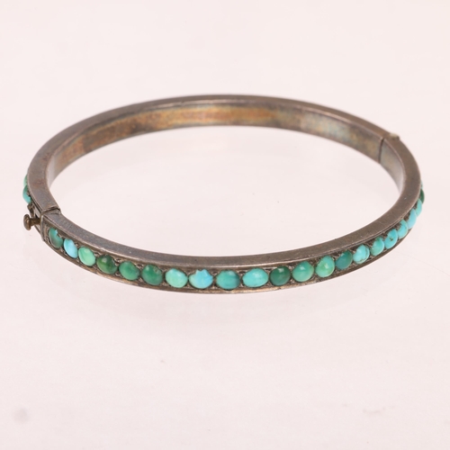 1369 - A Victorian silver turquoise hinged bangle, band width 4.6mm, internal circumference 15cm, 17.4g