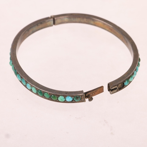 1369 - A Victorian silver turquoise hinged bangle, band width 4.6mm, internal circumference 15cm, 17.4g