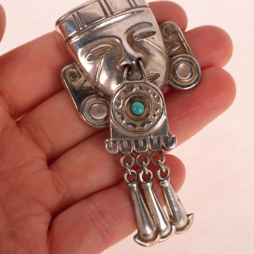 1387 - A Vintage Mexican sterling silver turquoise Aztec head brooch, with articulated drops, 78.3mm, 17.2g