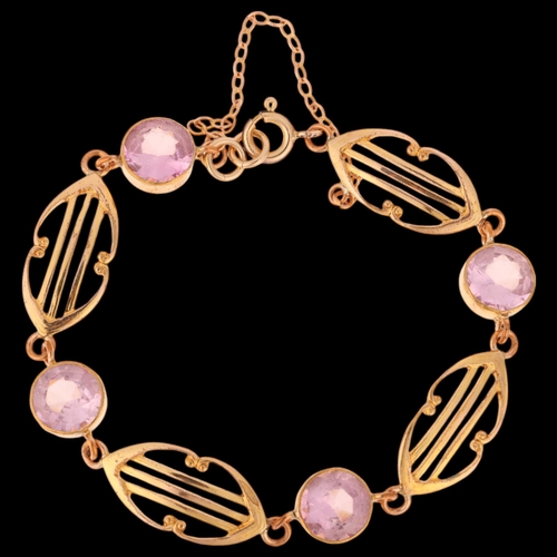 1393 - A gold plated pink paste openwork panel bracelet, in the Edwardian style, internal circumference 17c... 