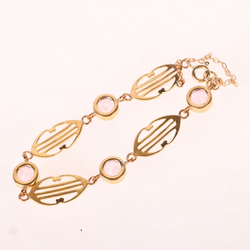 1393 - A gold plated pink paste openwork panel bracelet, in the Edwardian style, internal circumference 17c... 