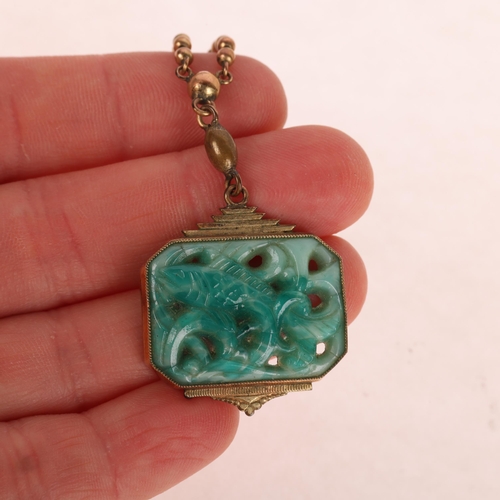 1394 - A Vintage German rolled gold green glass Orientalist fish pendant necklace, stamped 