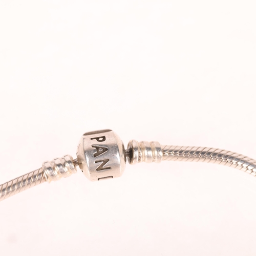 1397 - PANDORA - a sterling silver snake link charm bracelet, with 7 silver charms, 18cm, 35.7g