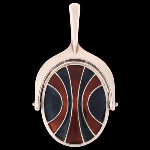 1398 - DAVID ANDERSEN - a Norwegian modernist sterling silver and enamel swivel pendant, 53.5mm, 24.5g