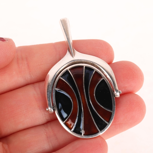 1398 - DAVID ANDERSEN - a Norwegian modernist sterling silver and enamel swivel pendant, 53.5mm, 24.5g