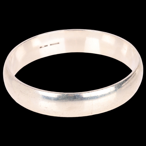 1408 - RANDERS SOLVVAREFABRIK - a heavy Danish sterling silver slave bangle, band width 14mm, internal circ... 