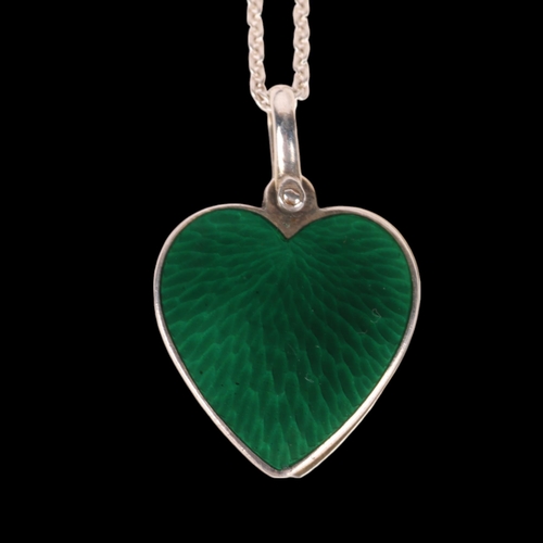 1409 - GUSTAV ADOLF SAELLSTROM - a Danish silver and green enamel sliding heart pendant necklace, on sterli... 