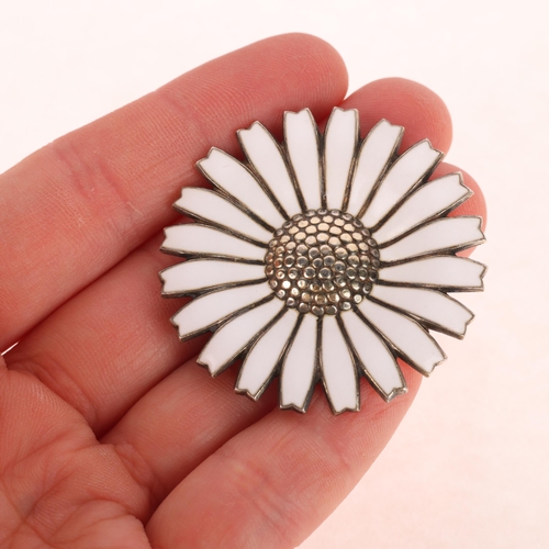 1414 - ANTON MICHELSEN - a Danish modernist vermeil sterling silver white enamel daisy pattern brooch, 42.5... 