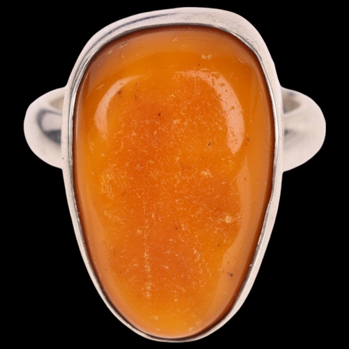 1429 - CHRISTIAN ELBRO JENSEN - a Danish sterling silver amber abstract ring, setting height 23.8mm, size Q... 