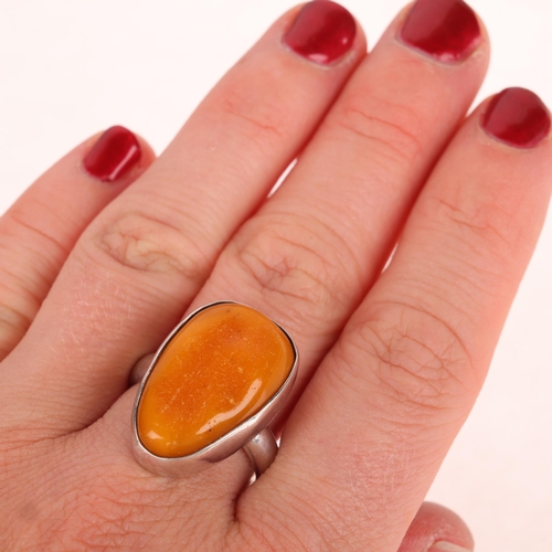 1429 - CHRISTIAN ELBRO JENSEN - a Danish sterling silver amber abstract ring, setting height 23.8mm, size Q... 