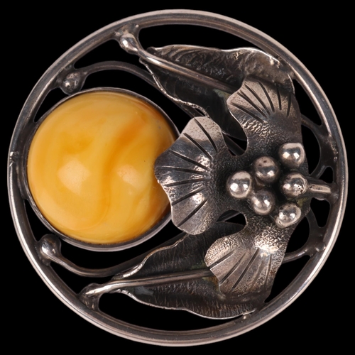 1448 - An Art Nouveau Danish sterling silver and amber floral brooch, circular openwork form, indistinct ma... 