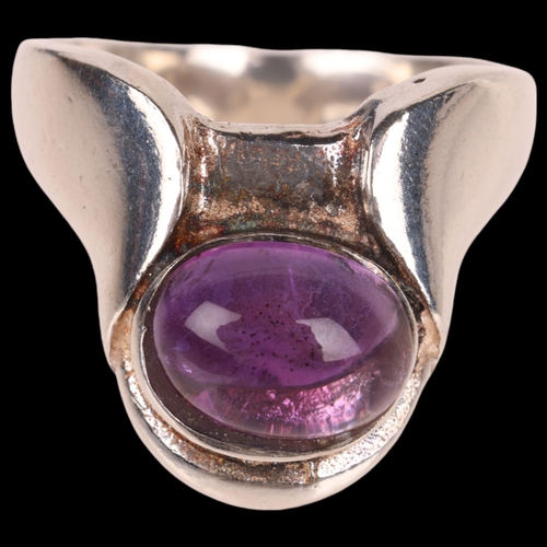 1449 - PETER ERNST RAVBUTIKKEN - a Danish modernist sterling silver amethyst ring, set with oval cabochon a... 