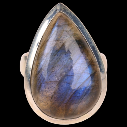 1453 - A sterling silver labradorite dress ring, set with pear cabochon labradorite, setting height 28.8mm,... 