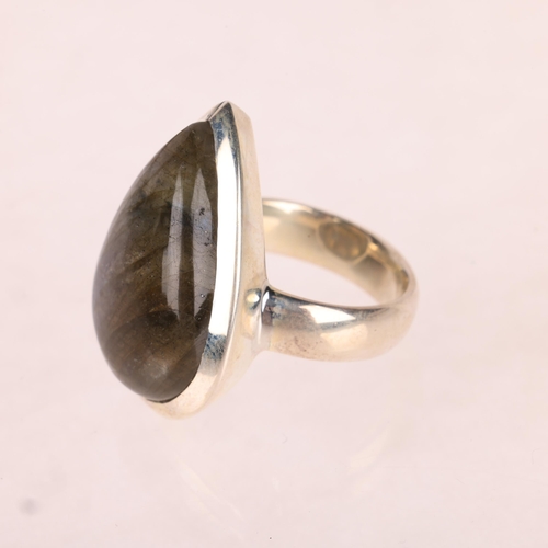 1453 - A sterling silver labradorite dress ring, set with pear cabochon labradorite, setting height 28.8mm,... 