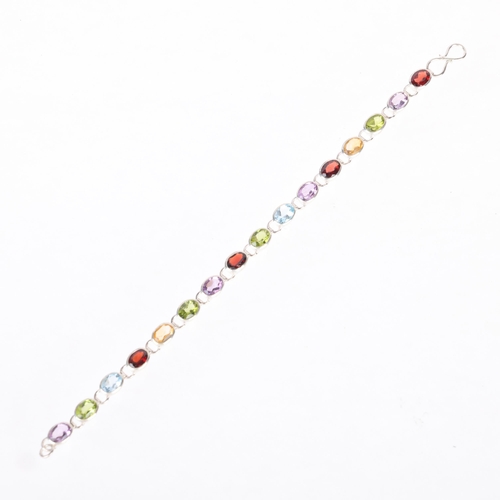 1454 - A sterling silver gem set tennis line bracelet, gemstones include garnet amethyst peridot and citrin... 