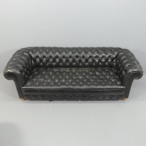 An vintage black leather Chesterfield style sofa. Overall 230x75x95cm