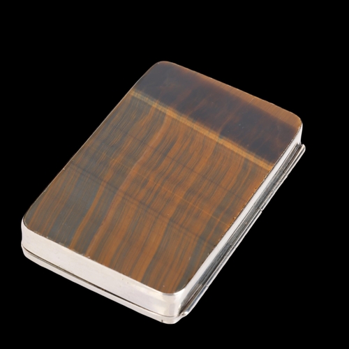 1501 - A sterling silver tigers eye cigarette case, each side set with polished rectangular tigers eye pane... 