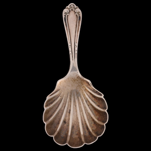 1510 - A George V silver shell tea caddy spoon, Josiah Williams & Co, London 1913, 8.5cm