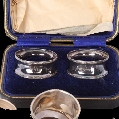 1538 - Various silver napkin rings, including cased pair, 5.2oz total