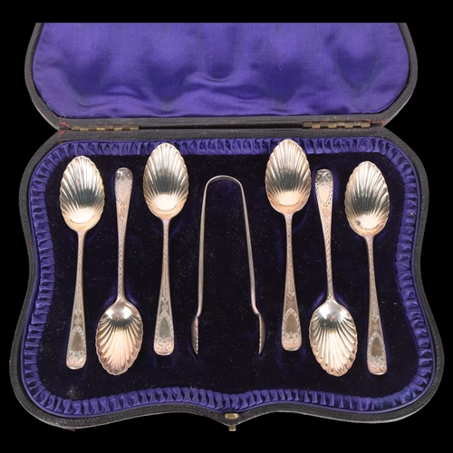 1560 - A cased set of Edwardian silver shell teaspoons and sugar tongs, Josiah Williams & Co, London 1902, ... 