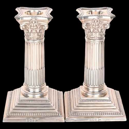 1564 - A pair of late Victorian silver Corinthian column table candlesticks, Walker & Hall, Sheffield 1897,... 