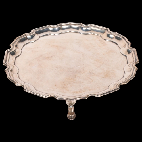 1572 - MAPPIN & WEBB - a George VI silver salver, scalloped rim raised on 3 feet, 20.5cm, 9.9oz