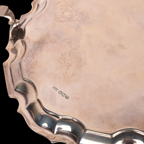 1572 - MAPPIN & WEBB - a George VI silver salver, scalloped rim raised on 3 feet, 20.5cm, 9.9oz