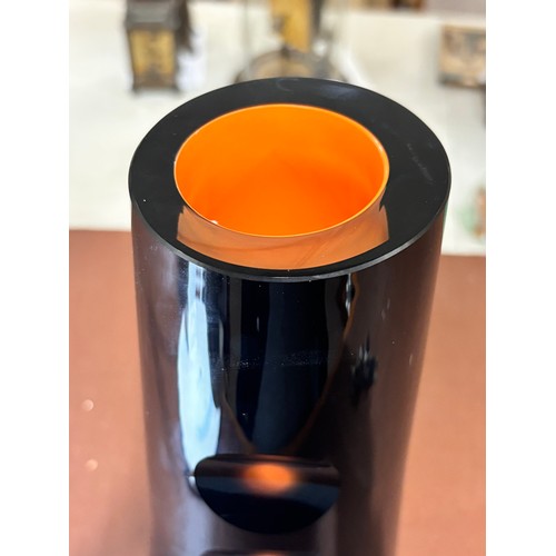 421 - JAN BERANEK for Sklo, a heavy walled black glass vase with orange lining and cut out detail, signed ... 