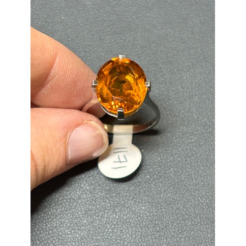 1171 - A platinum single stone citrine dress ring, set with oval mixed-cut citrine, setting height 16mm, si... 