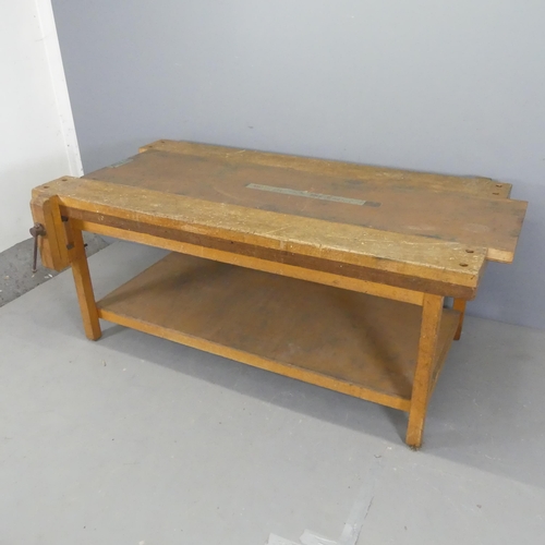 2535 - A vintage Japanese two-tier work bench, with sliding metal topped centre panel and fitted vice. W180... 