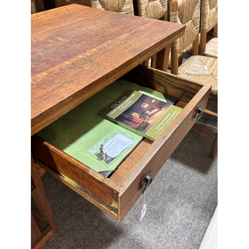 588 - An Arts and Crafts oak desk, attributed to L & J.G.Stickley, New York, with integral book shelves to... 