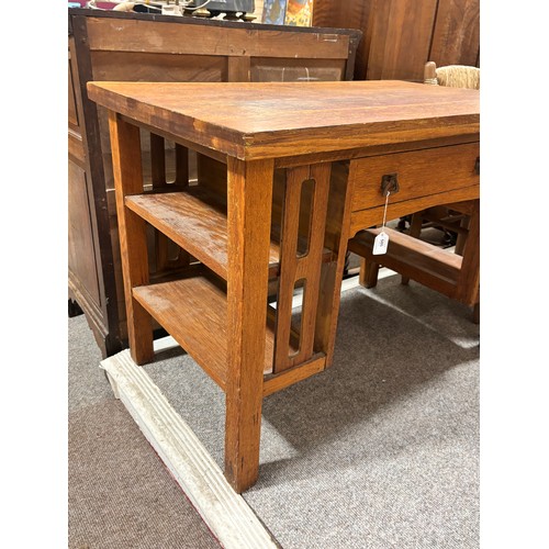 588 - An Arts and Crafts oak desk, attributed to L & J.G.Stickley, New York, with integral book shelves to... 