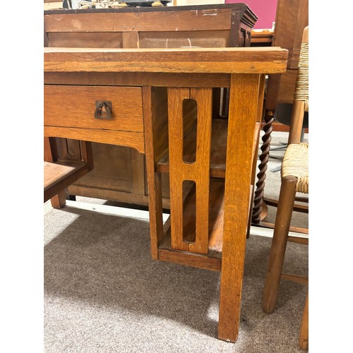 588 - An Arts and Crafts oak desk, attributed to L & J.G.Stickley, New York, with integral book shelves to... 