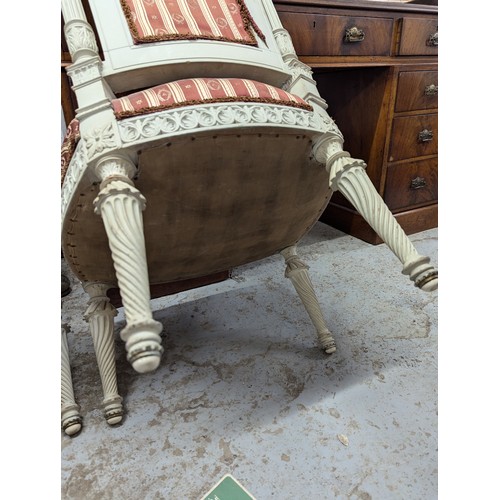 2551 - A set of three French bedroom / side chairs, with carved and painted wooden frames and upholstered s... 