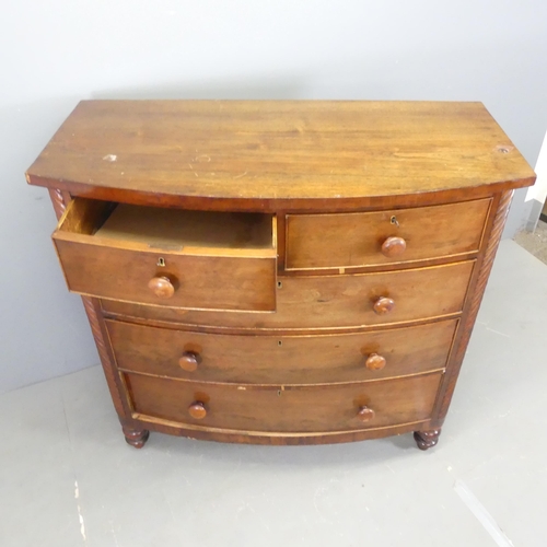 2555 - A Georgian mahogany bow-front chest of two short and three long drawers. W121cm, H116cm, D57cm.