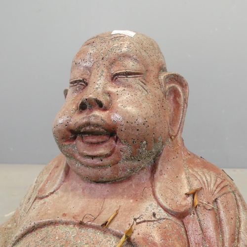 2609 - A painted concrete Buddha statue, height 47cm, and a concrete Sumo wrestler statue. (2)