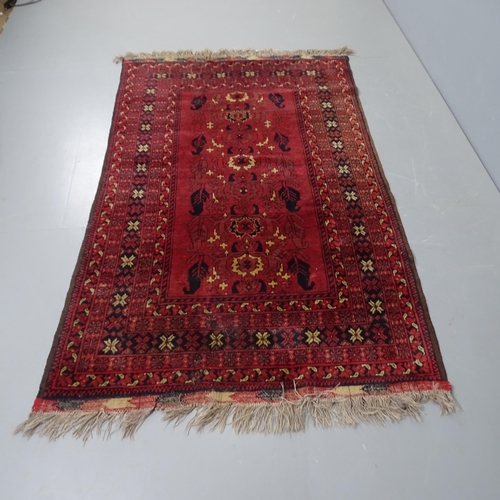 2298 - A red ground Persian rug, 205 x 125cm