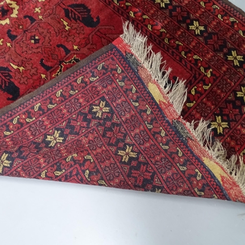 2298 - A red ground Persian rug, 205 x 125cm