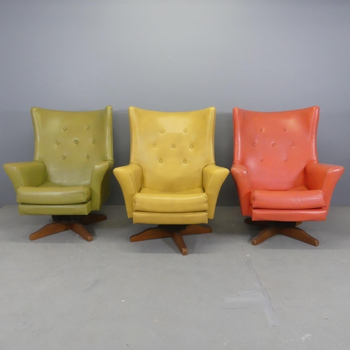 2505 - Three mid-century style rexine swivel lounge chairs.