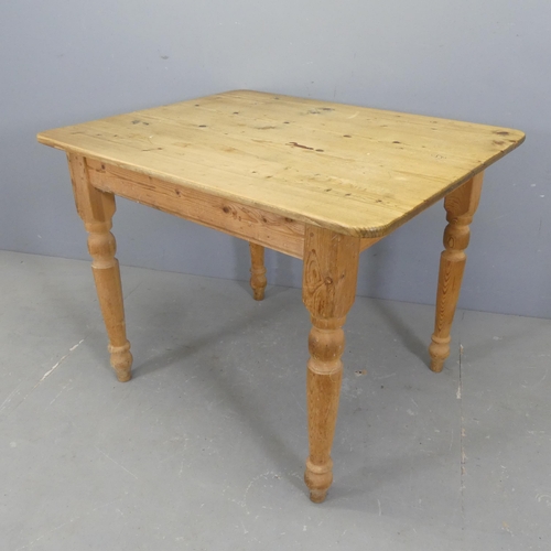 2506 - A modern pine scrub-top kitchen table raised on turned legs. Length 96cm, height 75cm, width 77cm.