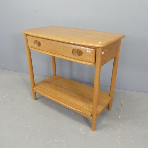 2509 - ERCOL - A Windsor two-tier console table. Length 80cm, height 72cm, depth 41cm.... 