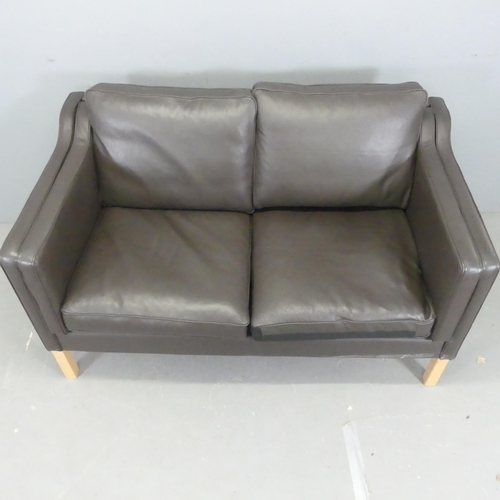 2515 - A modern Danish style leather upholstered two-seater sofa. Overall length 142cm, height 84cm, depth ... 