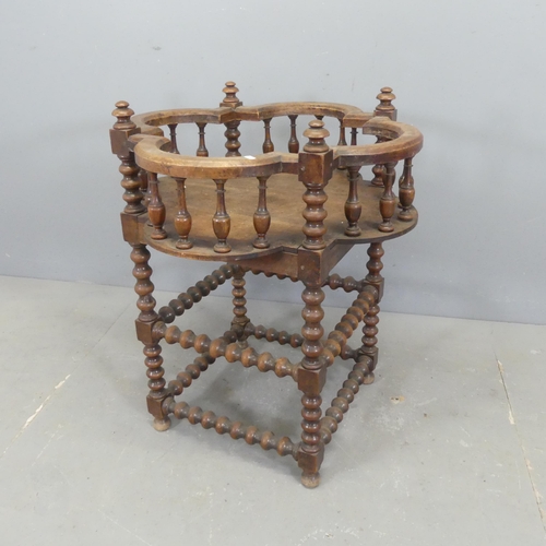 2516 - An antique oak plant stand with bobbin turned supports and galleried top. Width 66cm, height 81cm.